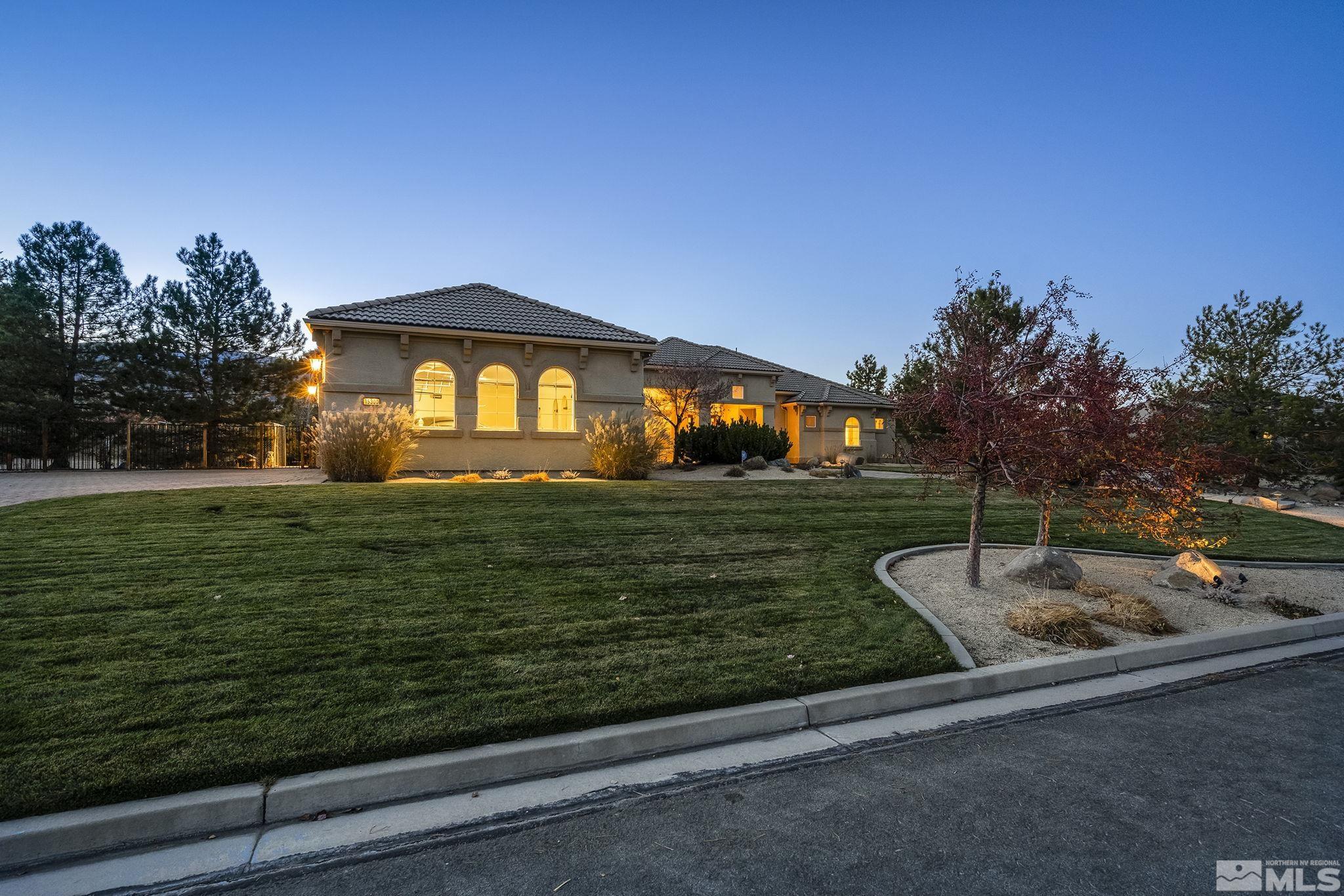 15300 Redmond Loop Reno, NV 89511 - Photo 6 of 38 a front view of a house with garden
