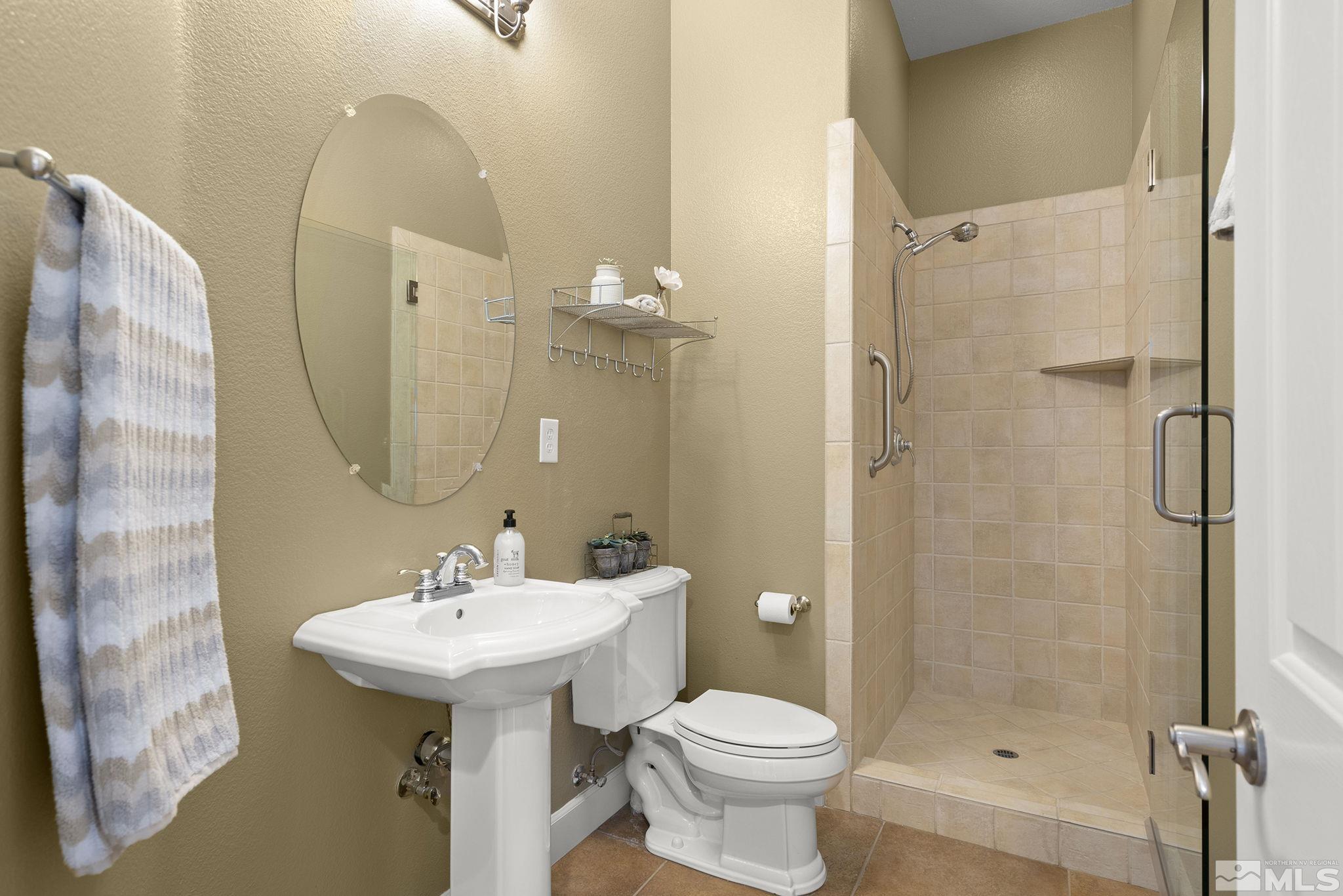 15300 Redmond Loop Reno, NV 89511 - Photo 10 of 38 a bathroom with a sink toilet and shower