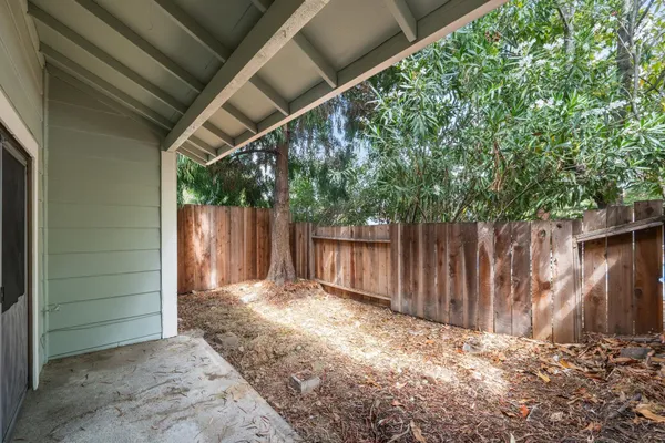 a view of an empty room with a fireplace