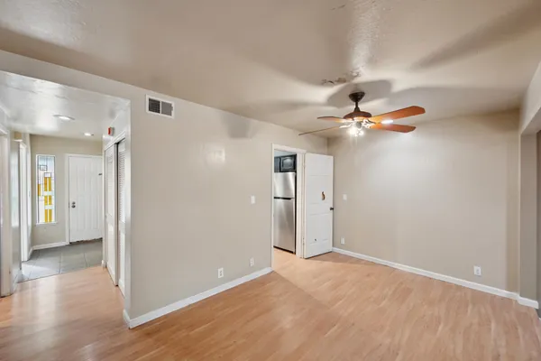 a kitchen with stainless steel appliances granite countertop a sink stove and wooden floor
