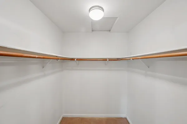 a bathroom with a granite countertop sink mirror and a bathtub