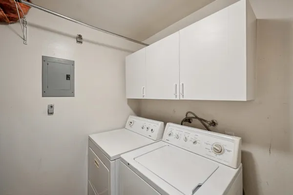 a view of a swimming pool with chairs in patio