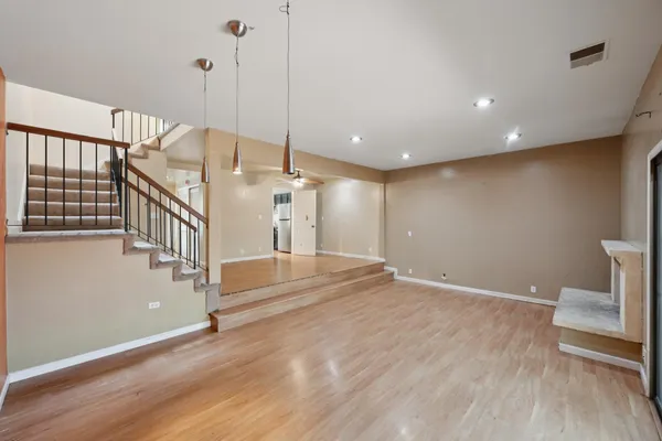 a view of an empty room with stairs