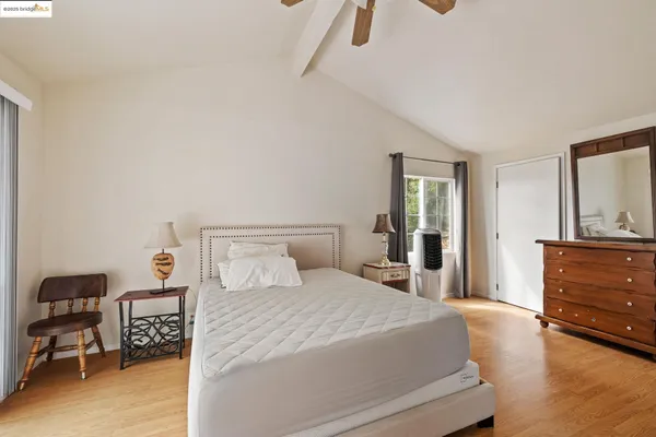 a bedroom with a bed and a dresser in it
