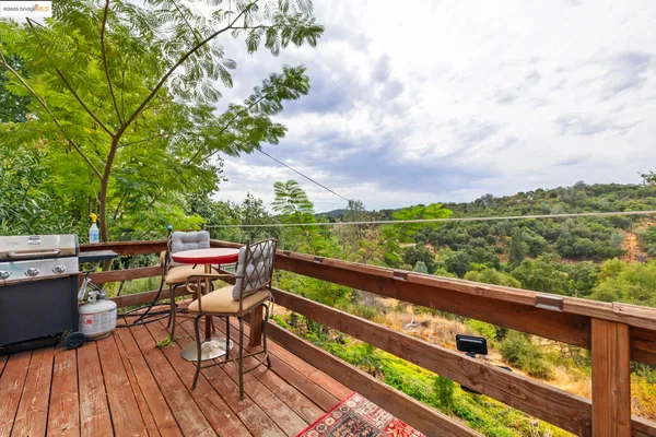 a view of a chairs and table on the deck