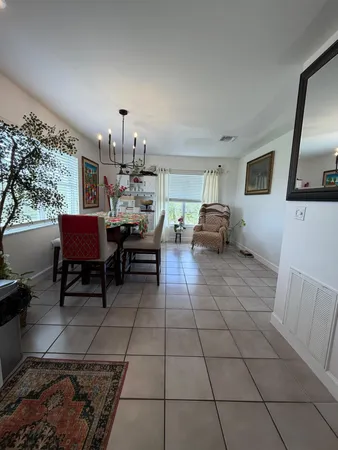 a bedroom with a bed and a flat tv screen on the dresser