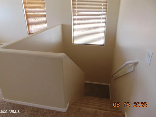 a view of an empty room and a window