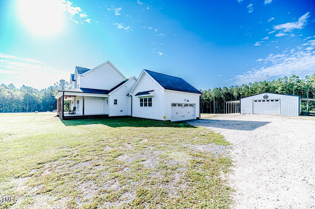 997 Jackson Road Fuquay-Varina, NC 27526 - Photo 11 of 75 a front view of a house with a yard
