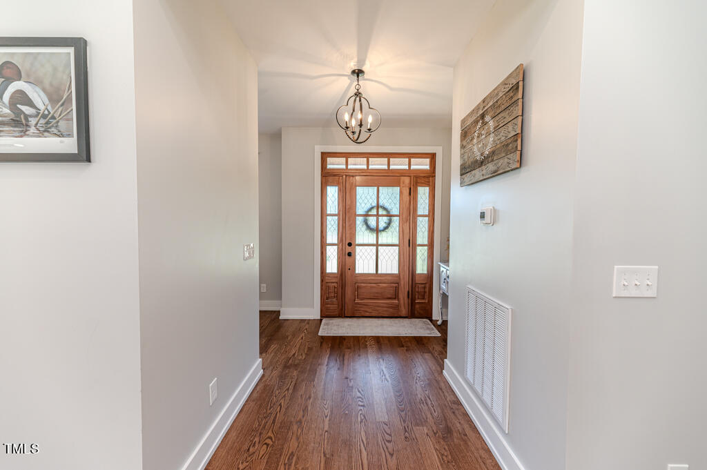 997 Jackson Road Fuquay-Varina, NC 27526 - Photo 15 of 75 a view of entryway with wooden floor