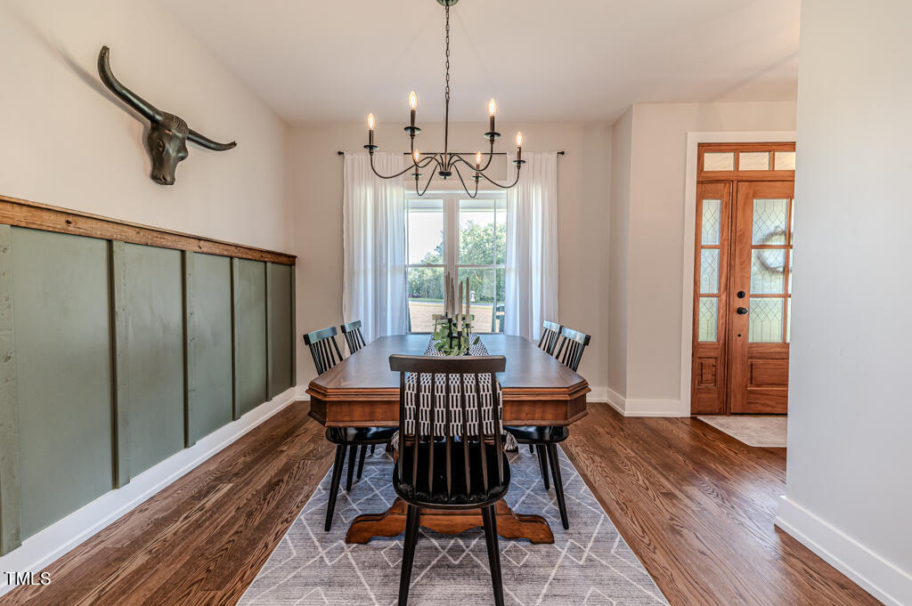 997 Jackson Road Fuquay-Varina, NC 27526 - Photo 17 of 75 a view of a dining room with furniture window and wooden floor