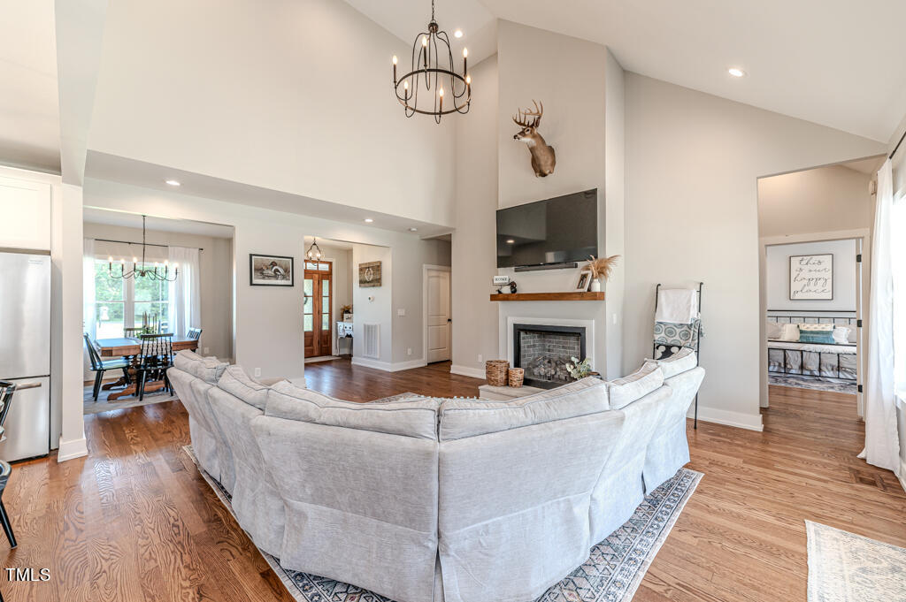 997 Jackson Road Fuquay-Varina, NC 27526 - Photo 19 of 75 a living room with fireplace furniture and a flat screen tv