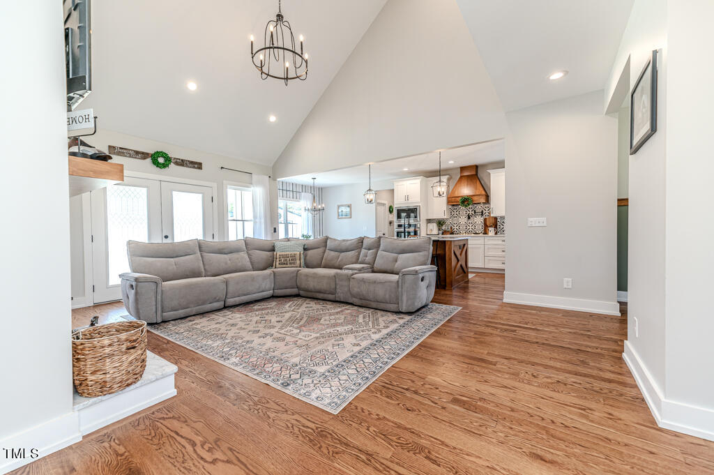 997 Jackson Road Fuquay-Varina, NC 27526 - Photo 20 of 75 a living room with furniture or kitchen and a wooden floor