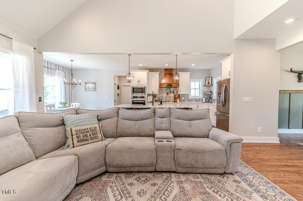 997 Jackson Road Fuquay-Varina, NC 27526 - Photo 23 of 75 a living room with furniture and kitchen view