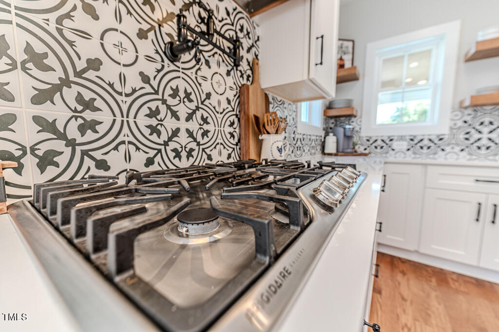 997 Jackson Road Fuquay-Varina, NC 27526 - Photo 28 of 75 a kitchen with a stove and a sink
