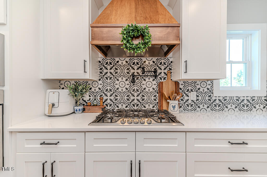 997 Jackson Road Fuquay-Varina, NC 27526 - Photo 29 of 75 a bathroom with a sink and a mirror