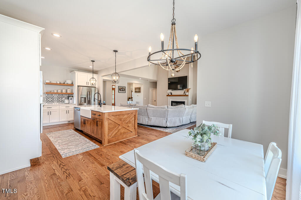 997 Jackson Road Fuquay-Varina, NC 27526 - Photo 35 of 75 a living room with lots of furniture and kitchen view