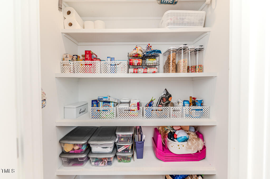 997 Jackson Road Fuquay-Varina, NC 27526 - Photo 38 of 75 a utility room with lots of clutter and cabinets