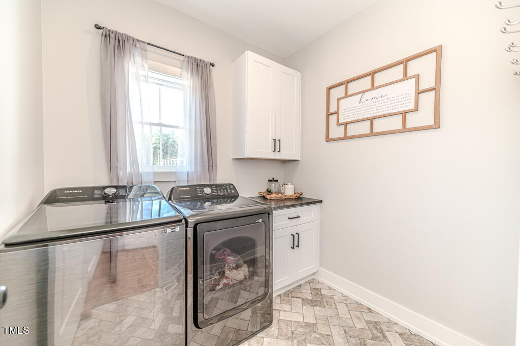 997 Jackson Road Fuquay-Varina, NC 27526 - Photo 42 of 75 a kitchen with stainless steel appliances granite countertop a sink stove and refrigerator