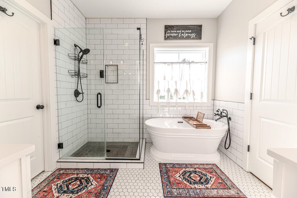 997 Jackson Road Fuquay-Varina, NC 27526 - Photo 48 of 75 a bathroom with a sink a toilet and shower