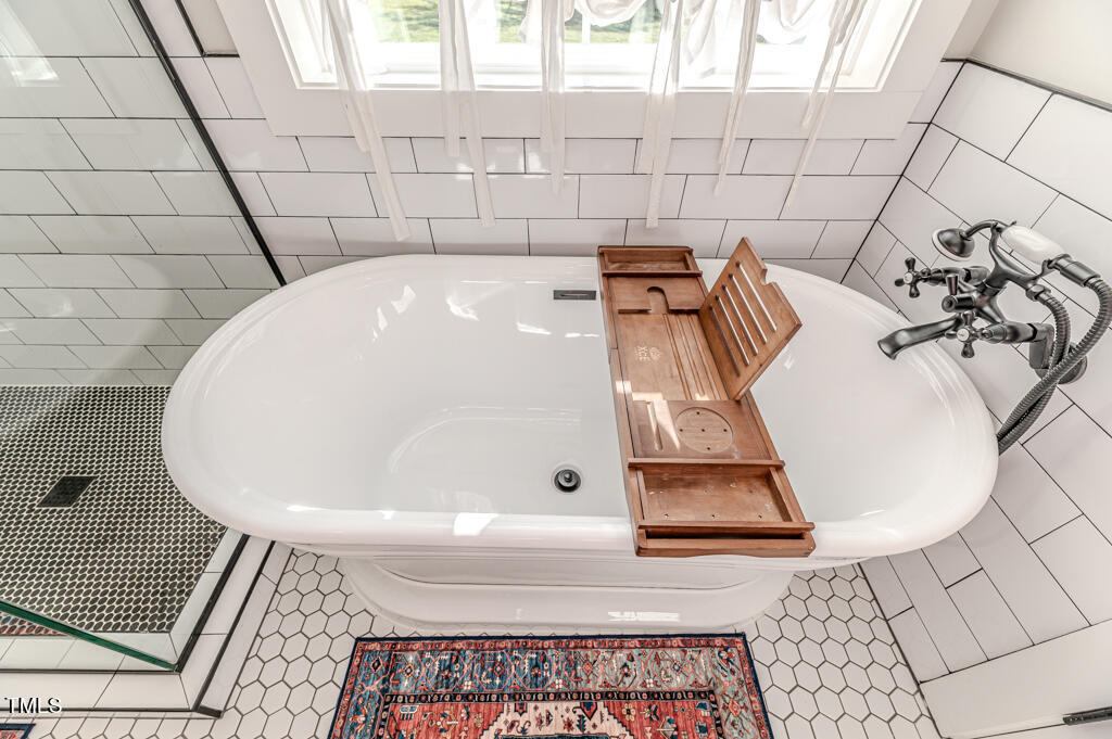 997 Jackson Road Fuquay-Varina, NC 27526 - Photo 49 of 75 a bathroom with a bathtub