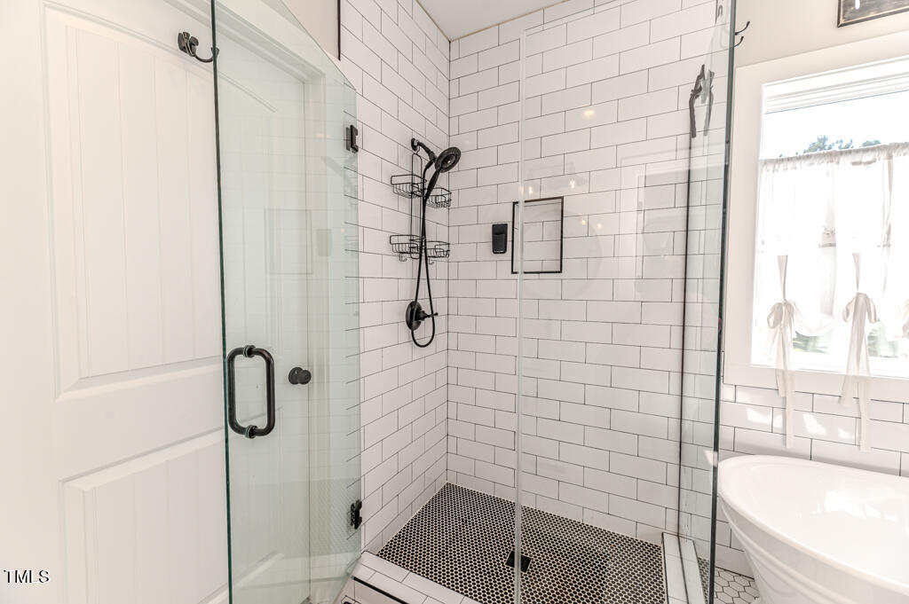 997 Jackson Road Fuquay-Varina, NC 27526 - Photo 50 of 75 a bathroom with a shower and a sink