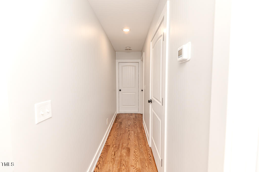 997 Jackson Road Fuquay-Varina, NC 27526 - Photo 58 of 75 a view of a hallway with a white walls