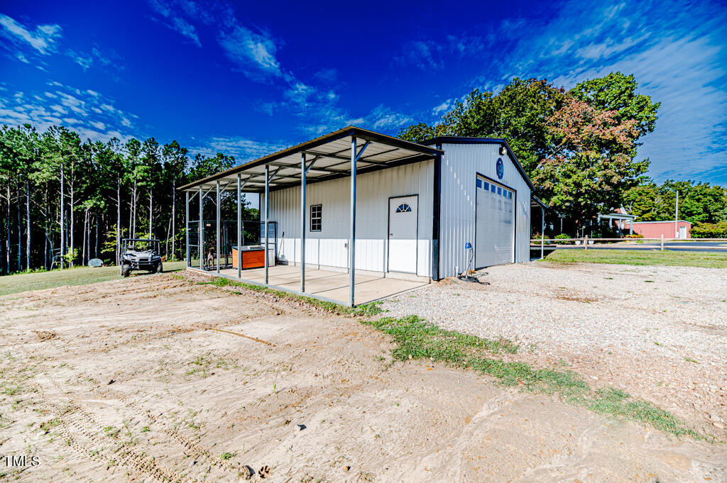 997 Jackson Road Fuquay-Varina, NC 27526 - Photo 66 of 75 a view of a house with a yard