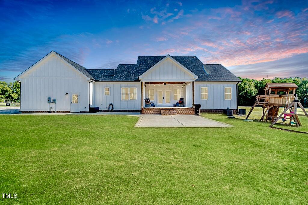 997 Jackson Road Fuquay-Varina, NC 27526 - Photo 9 of 75 a view of a house with a yard patio and fire pit
