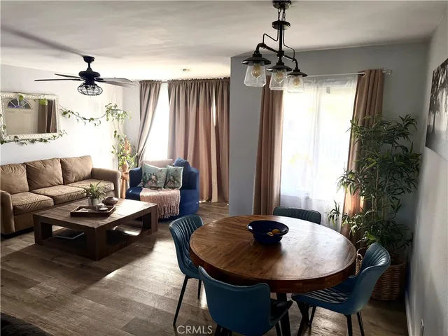 a view of a dining room with furniture and window