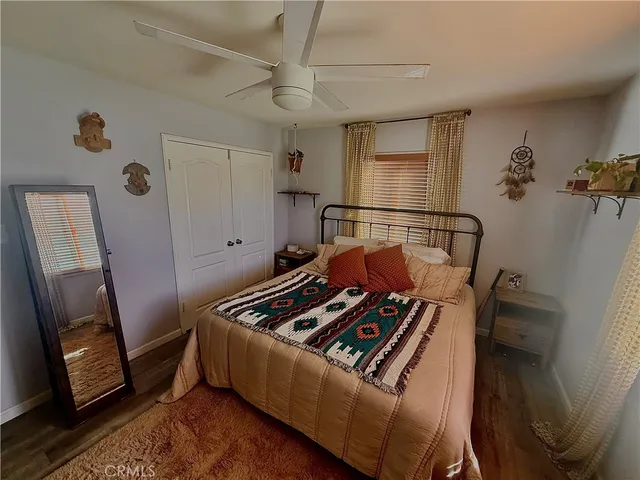a view of room with window and wooden floor