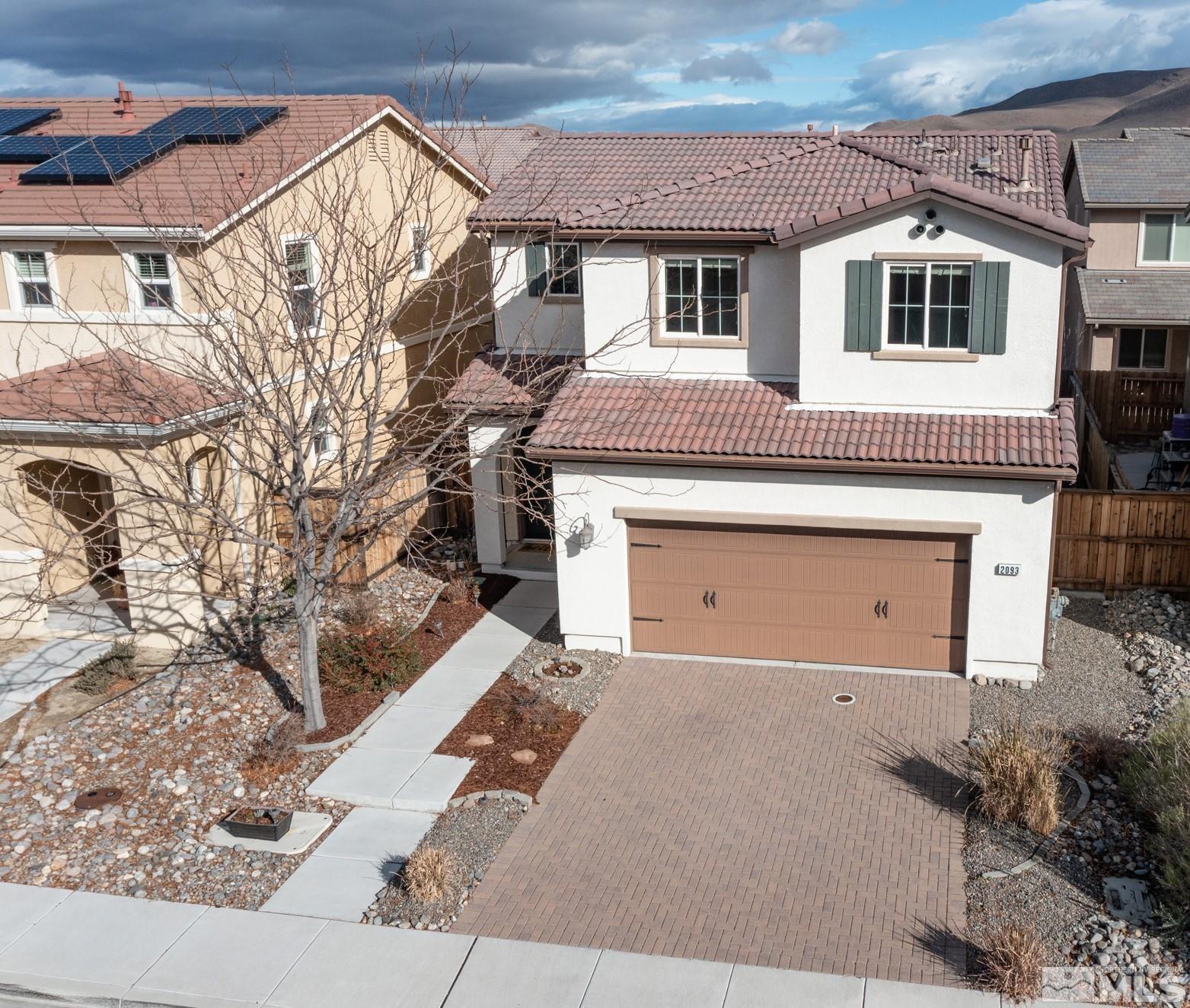 2093 Waterhouse Road Reno, NV 89521 - Photo 1 of 30 a front view of a house with a yard and garage