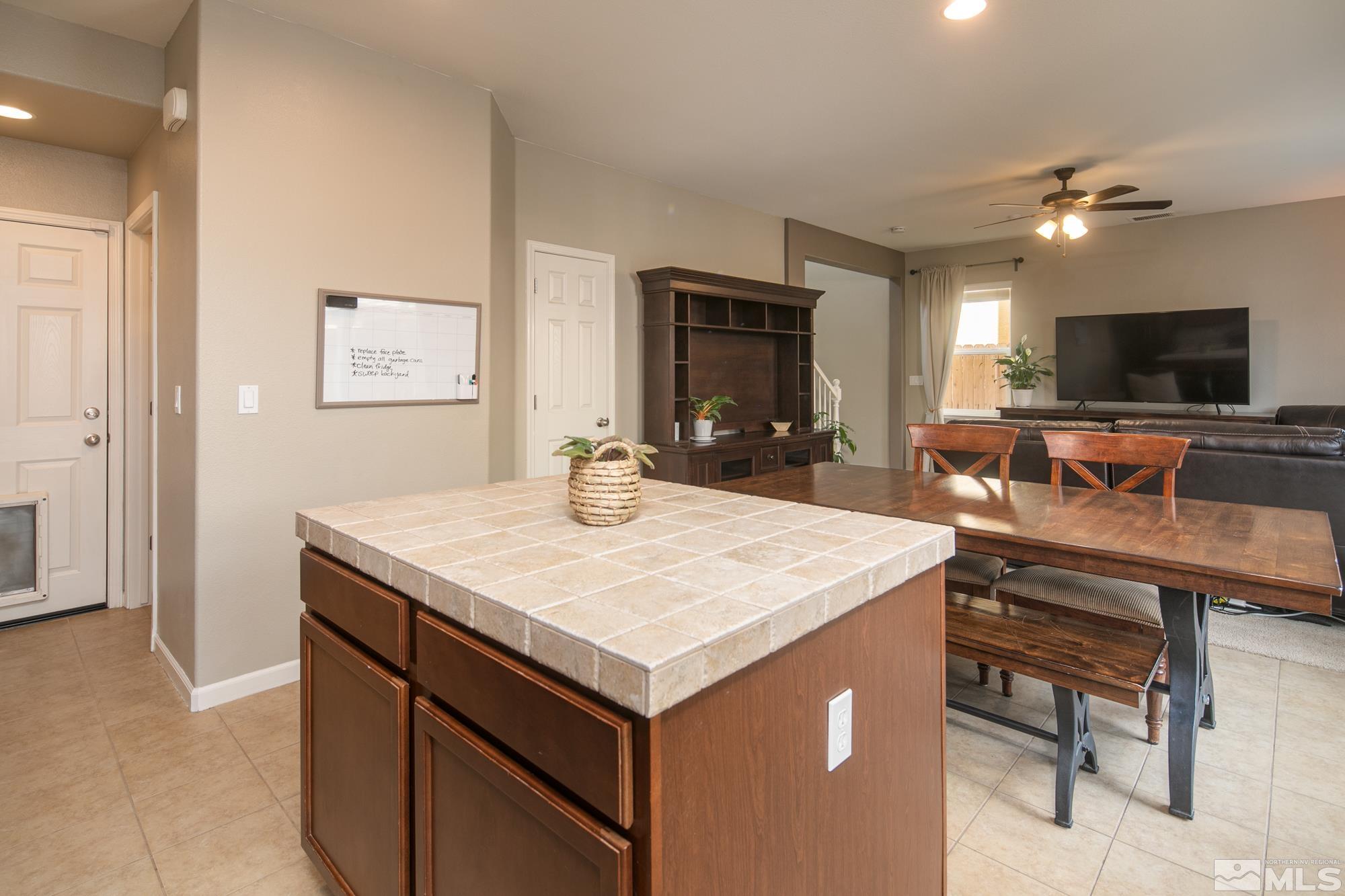 2093 Waterhouse Road Reno, NV 89521 - Photo 11 of 30 a view of kitchen island with sink furniture and wooden floor