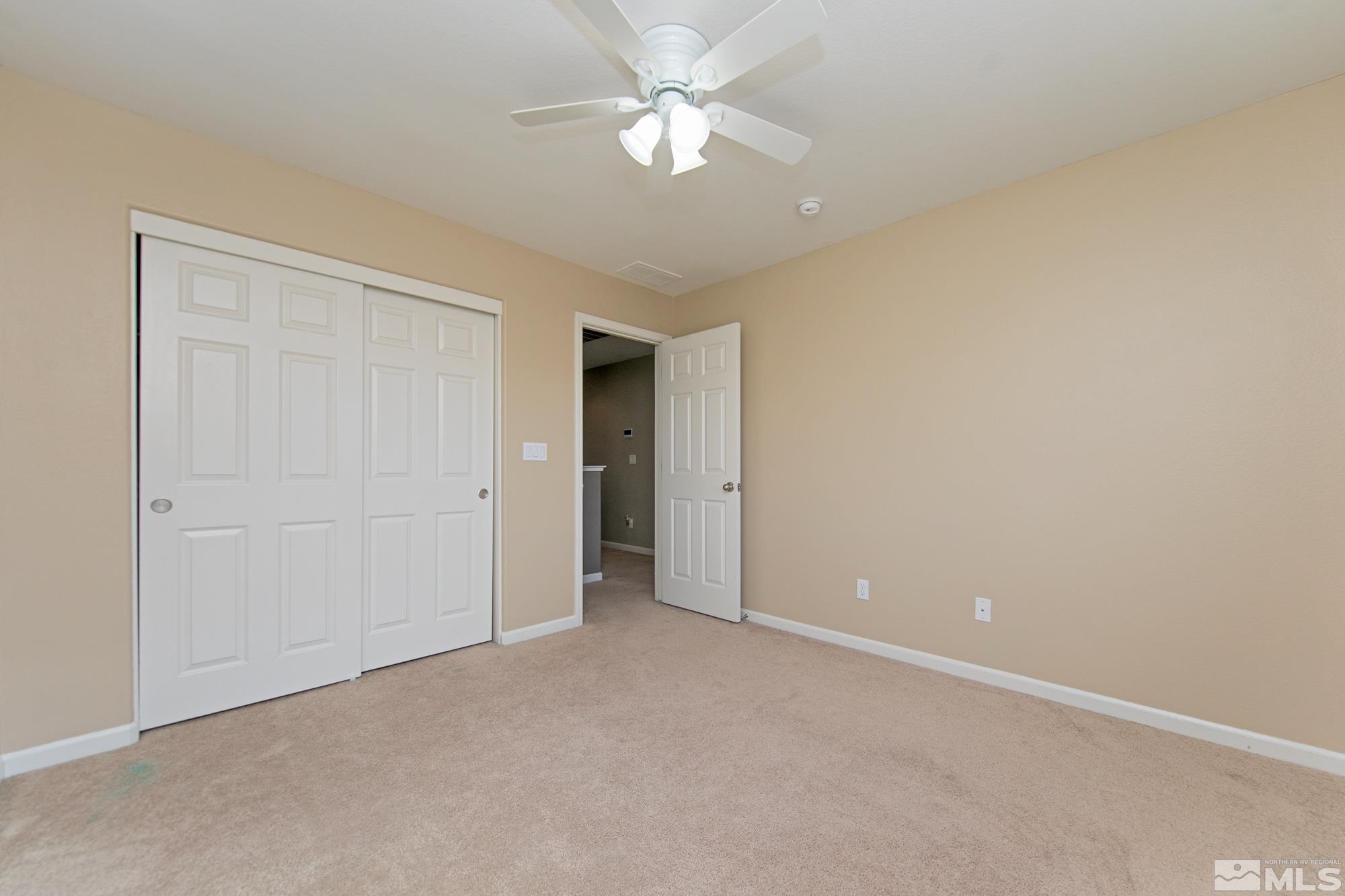 2093 Waterhouse Road Reno, NV 89521 - Photo 20 of 30 a view of an empty room and a ceiling fan