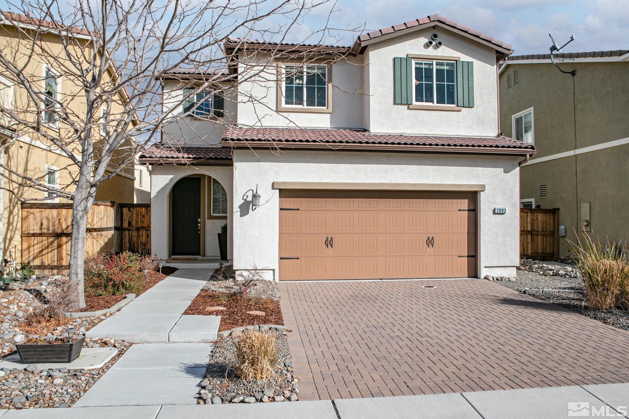 2093 Waterhouse Road Reno, NV 89521 - Photo 2 of 30 a front view of a house with a yard