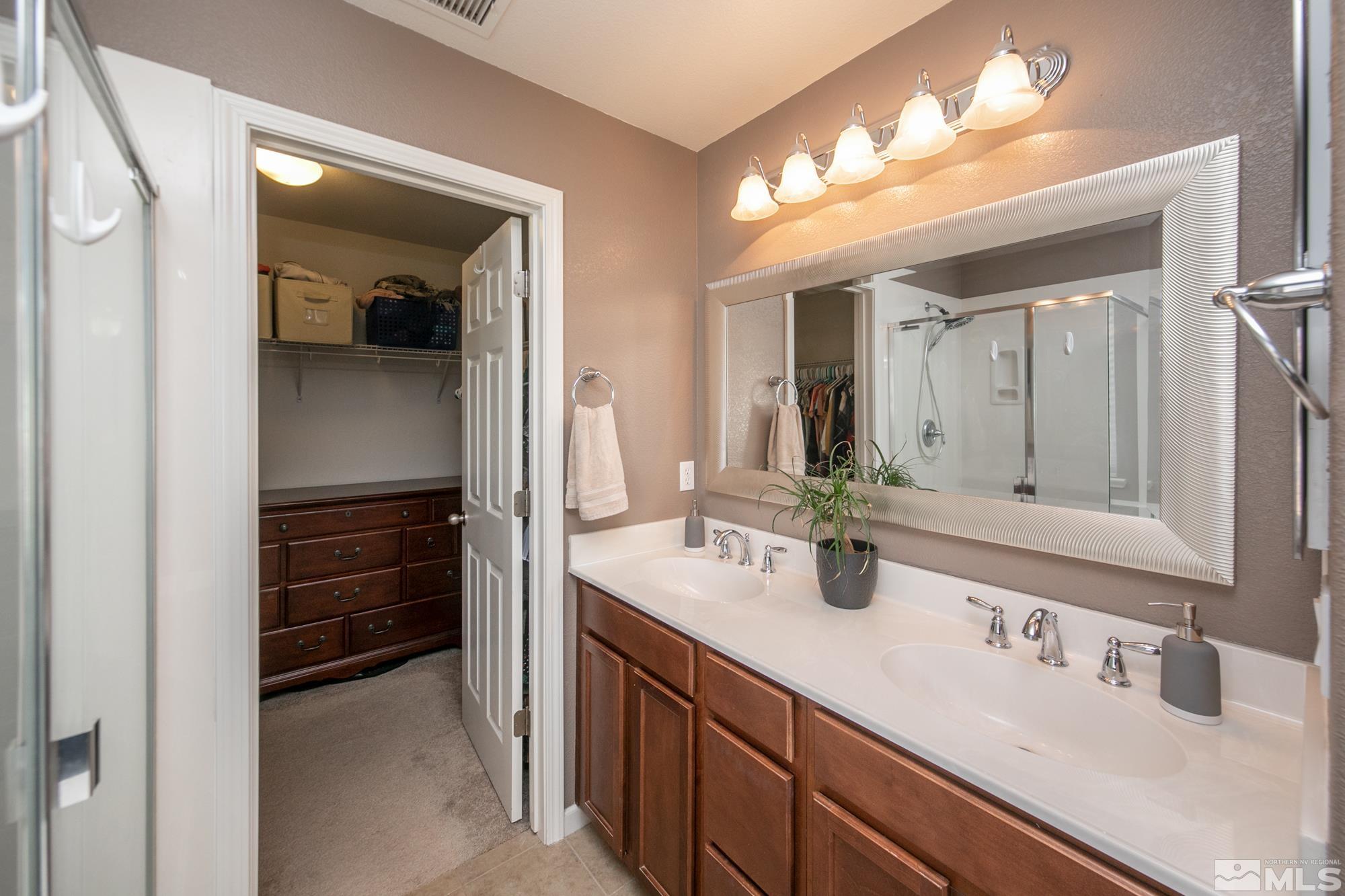 2093 Waterhouse Road Reno, NV 89521 - Photo 24 of 30 a bathroom with a sink and a mirror