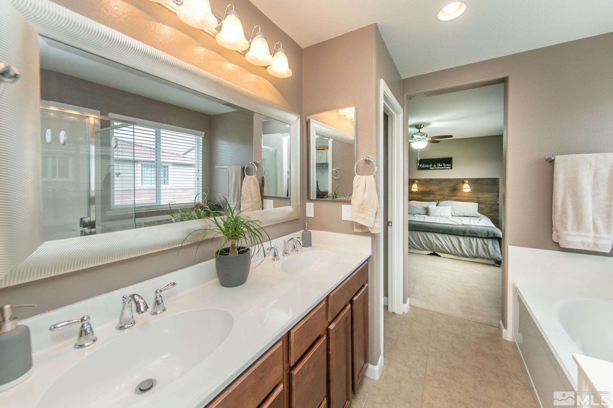 2093 Waterhouse Road Reno, NV 89521 - Photo 25 of 30 a en suite bathroom with sink and mirror