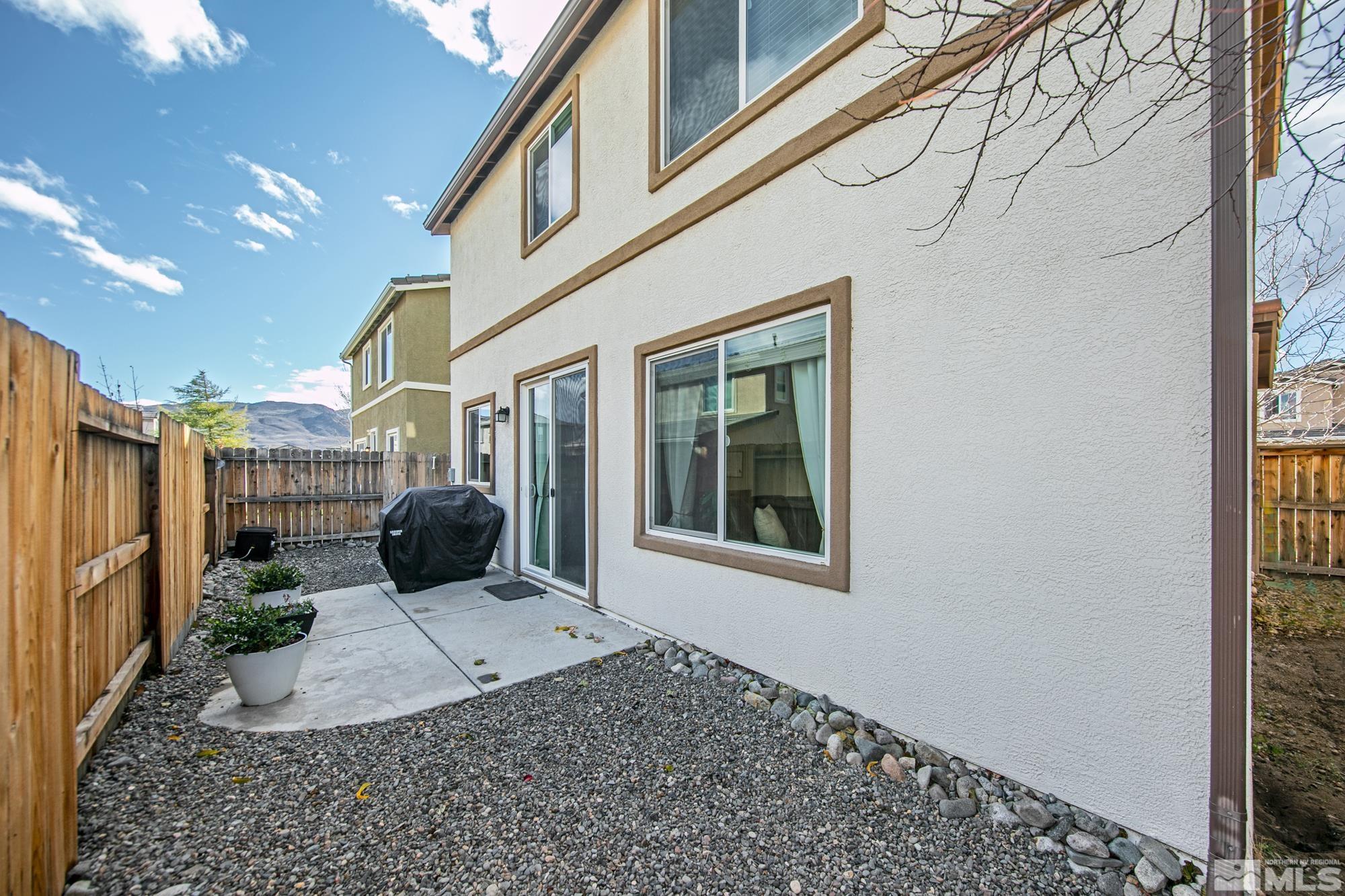 2093 Waterhouse Road Reno, NV 89521 - Photo 27 of 30 a view of a house with backyard and sitting area
