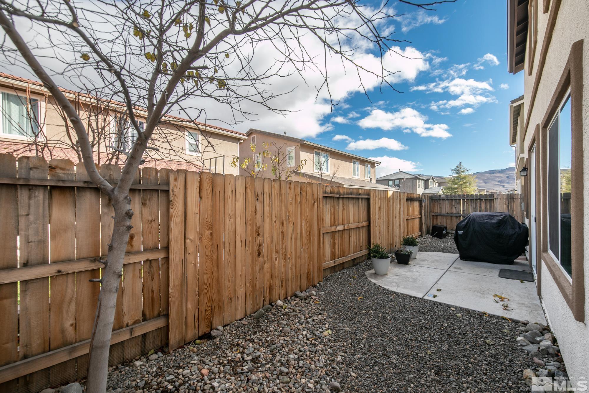 2093 Waterhouse Road Reno, NV 89521 - Photo 29 of 30 a view of a backyard with a large tree