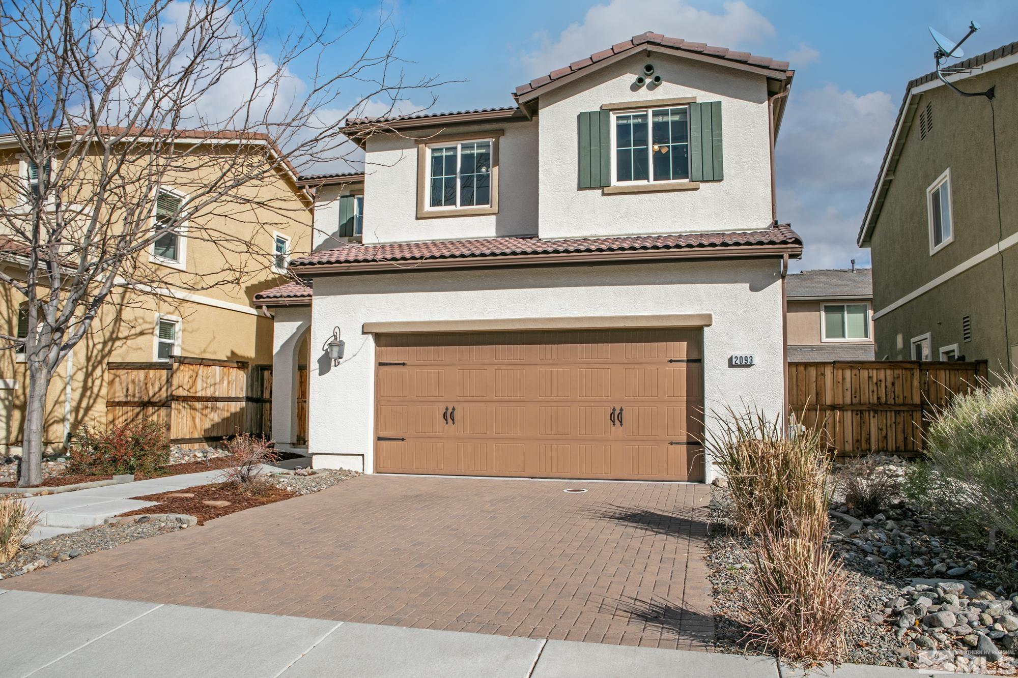 2093 Waterhouse Road Reno, NV 89521 - Photo 3 of 30 a front view of a house with a yard and garage