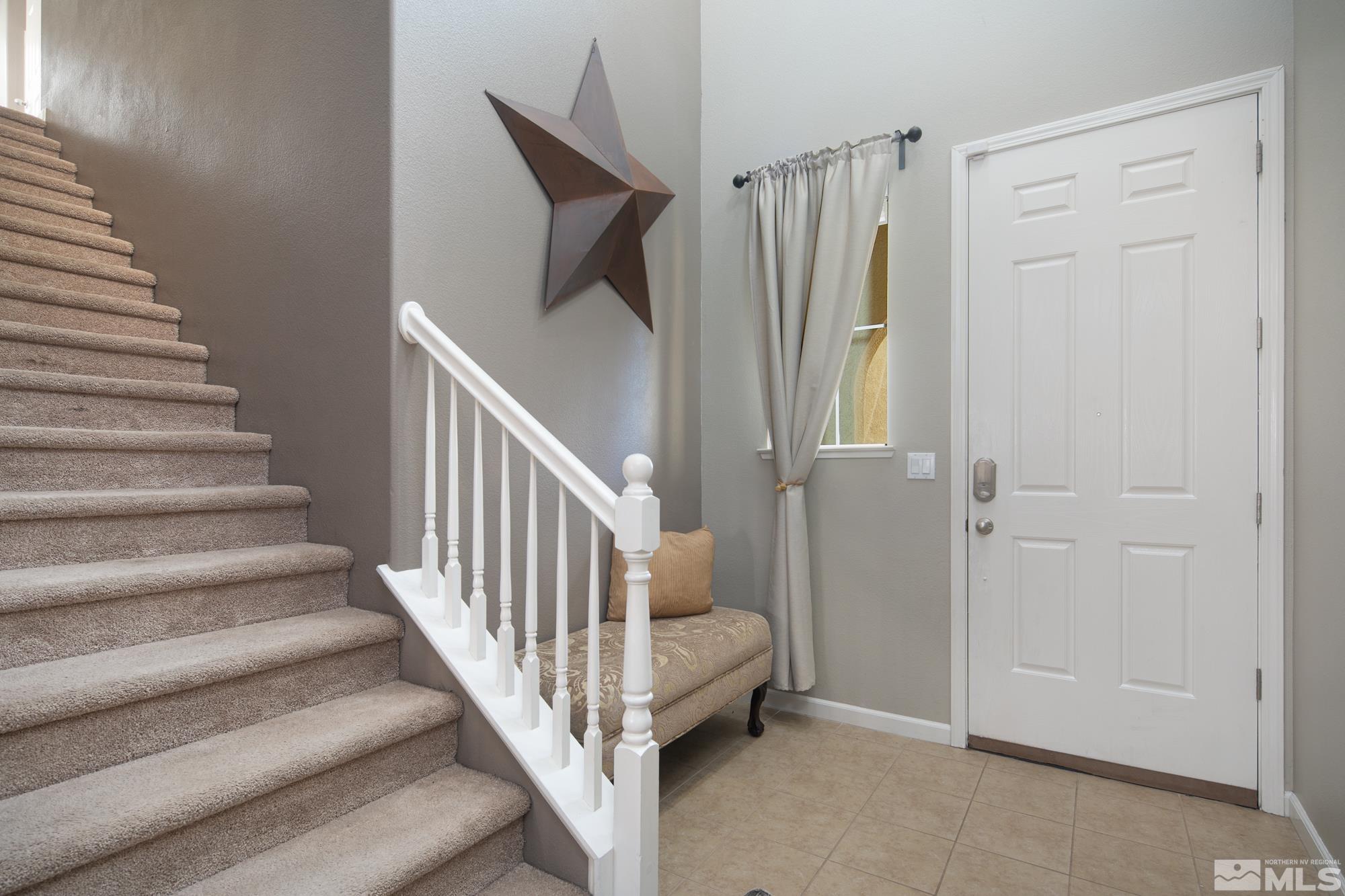 2093 Waterhouse Road Reno, NV 89521 - Photo 4 of 30 a view of a staircase and closet with wooden floor