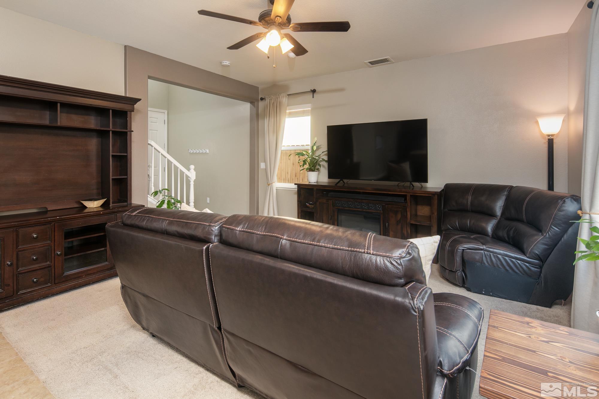 2093 Waterhouse Road Reno, NV 89521 - Photo 7 of 30 a living room with furniture and a flat screen tv