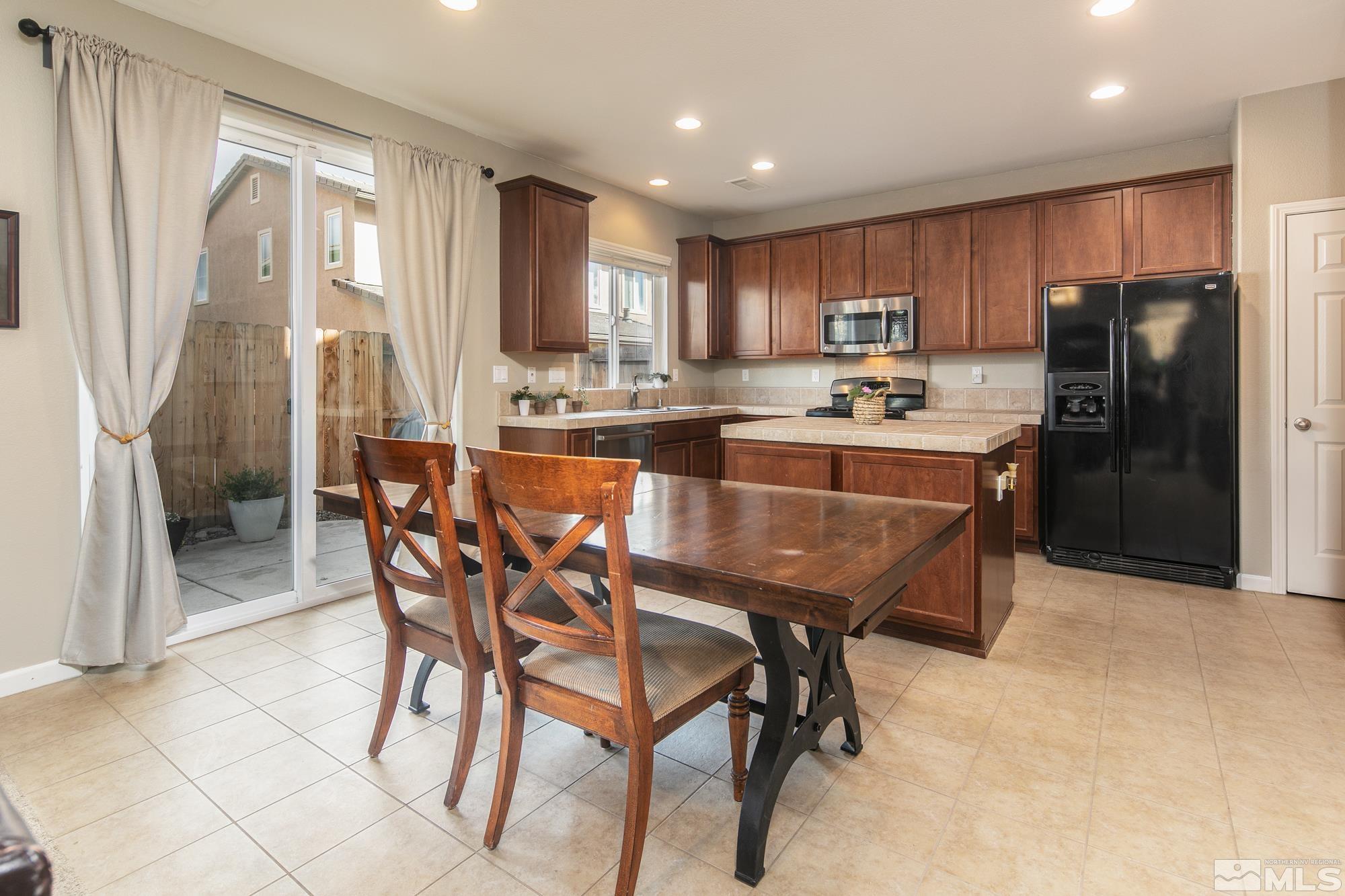2093 Waterhouse Road Reno, NV 89521 - Photo 8 of 30 a view of a dining room with furniture