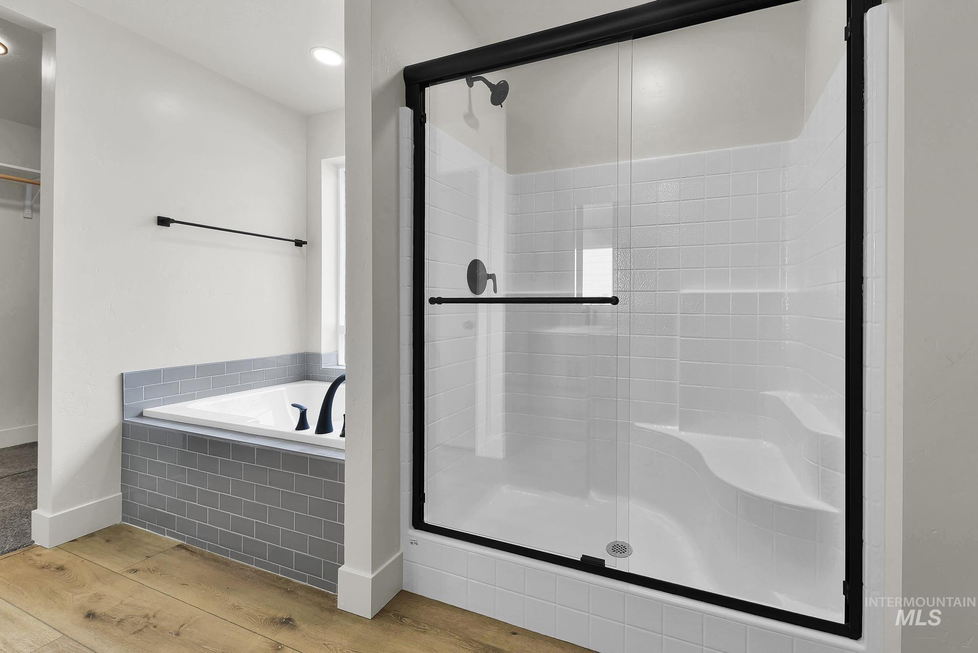 1130 Velvet Loop Wilder, ID 83676 - Photo 21 of 35 Full-size shower with matte black framed glass enclosure