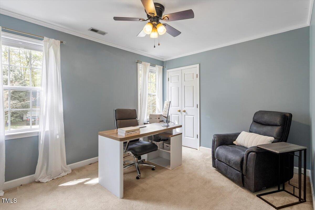 4725 Sinclair Drive Raleigh, NC 27616 - Photo 17 of 36 a view of a workspace with furniture and a window