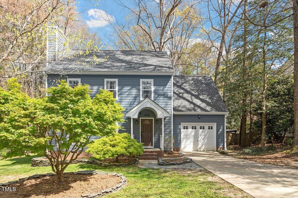 4725 Sinclair Drive Raleigh, NC 27616 - Photo 2 of 36 a front view of a house with garden