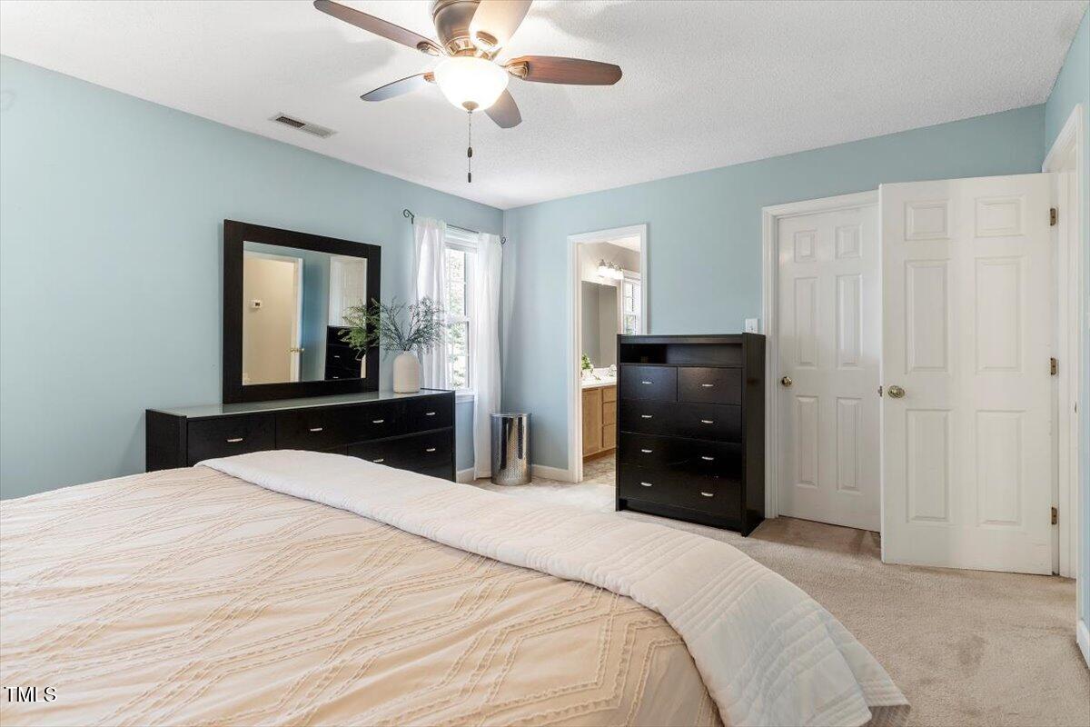 4725 Sinclair Drive Raleigh, NC 27616 - Photo 25 of 36 a bedroom with a bed and a dresser