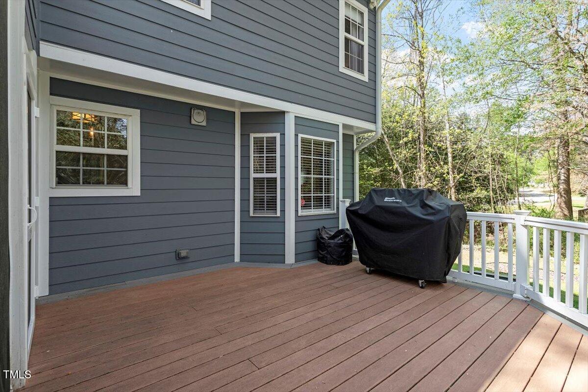 4725 Sinclair Drive Raleigh, NC 27616 - Photo 32 of 36 a view of a house with a barbeque and wooden floor