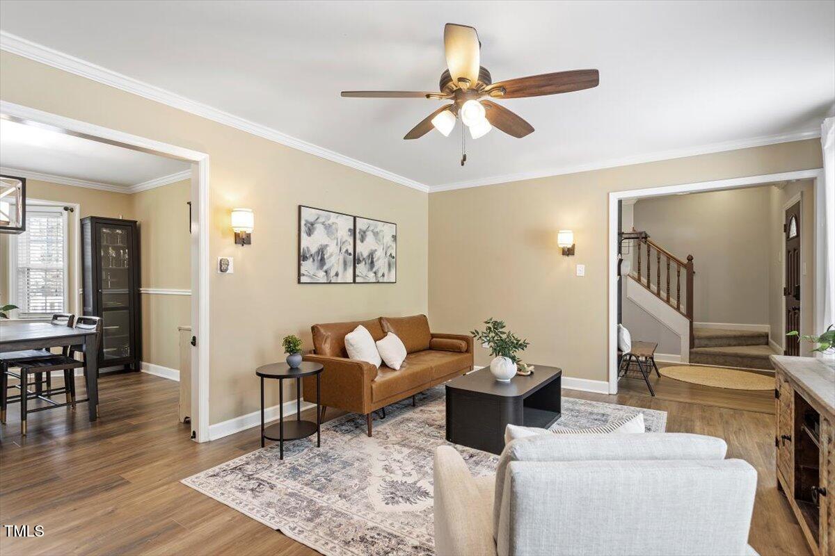 4725 Sinclair Drive Raleigh, NC 27616 - Photo 9 of 36 a living room with furniture and wooden floor