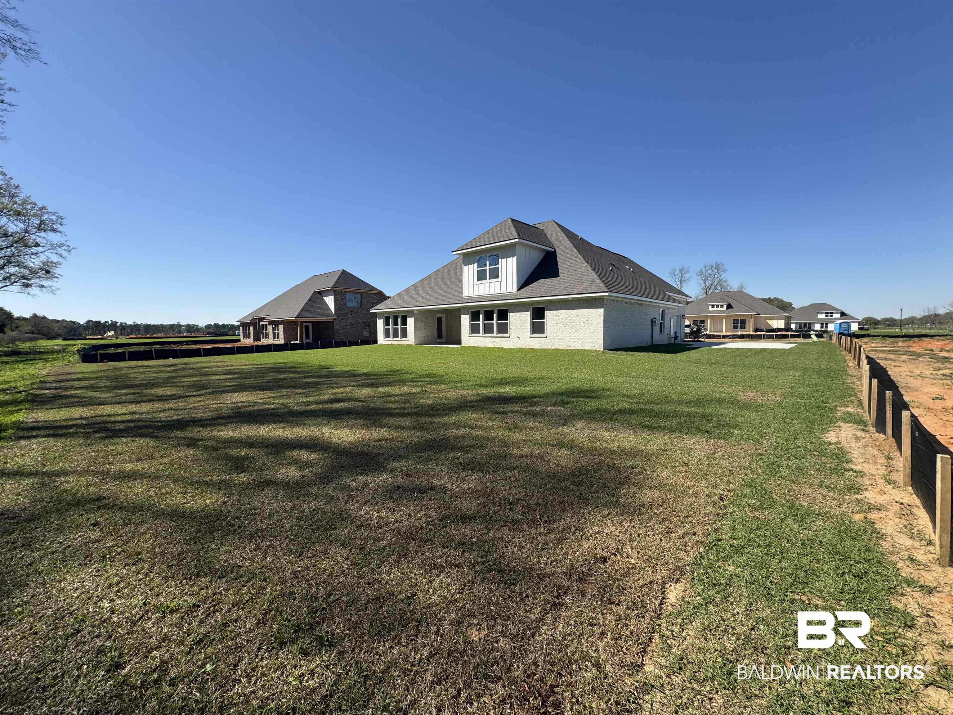 302 Morning Mist Way Fairhope, AL 36532 - Photo 5 of 33 View of yard featuring fence