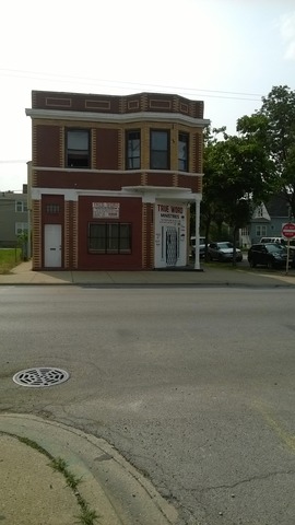 11700 South Michigan Avenue Chicago, IL 60628 - Photo 6 of 8 a front view of a house with a garage